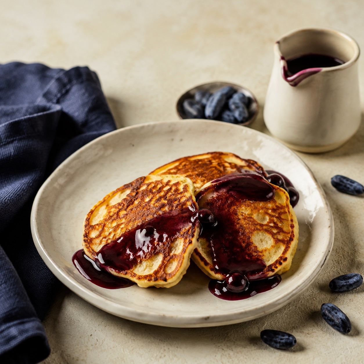 Golden pancakes with honeyberry syrup